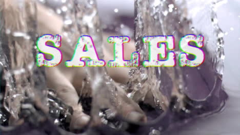 Animation-of-sales-text-over-hand-splashing-water