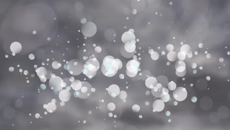 Animation-of-white-spots-moving-on-gray-background