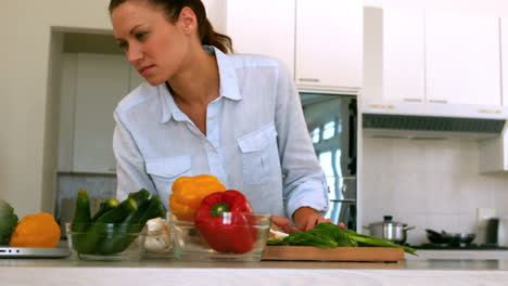 Woman-following-recipe-on-laptop