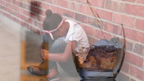 Animation-of-pouring-alcohol-over-sad-biracial-girl-sitting-at-wall