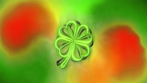 Animation-of-flashing-green-neon-st-patrick''s-day-shamrock-on-red-and-green-blurred-background