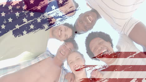 Animation-of-flag-of-usa-over-happy-diverse-friends-on-beach-in-summer