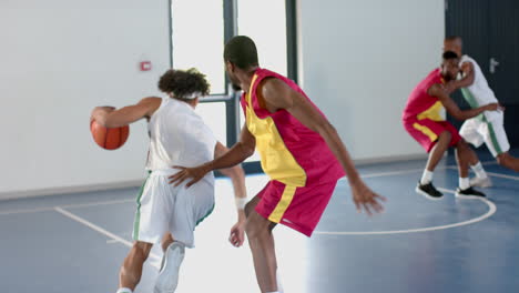 A-group-of-friends-is-playing-basketball-in-an-indoor-court