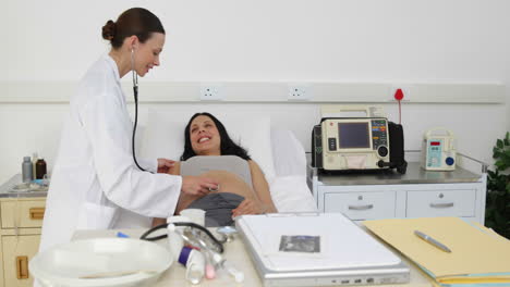 Brunette-pregnant-woman-being-checked-by-doctor