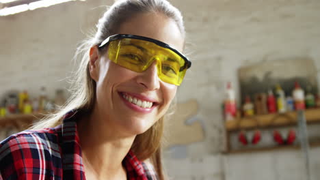 Portrait-of-attractive-carpenter-smiling-for-camera