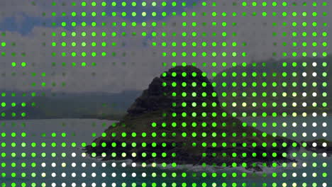 Animation-of-green-spots-over-rock-on-sea