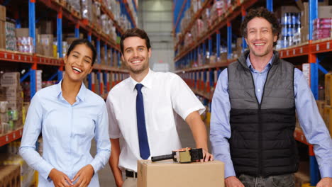 Warehouse-workers-looking-to-the-camera-together-