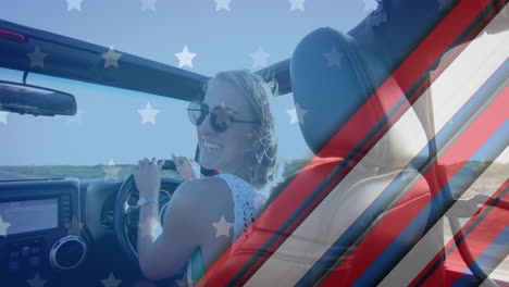 Animation-of-flag-of-usa-over-caucasian-woman-driving-car-on-beach