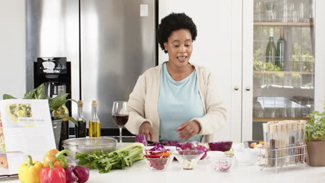 Play-back-cookery-show-of-an-African-American-woman-prepares-to-cook-in-a-modern-kitchen