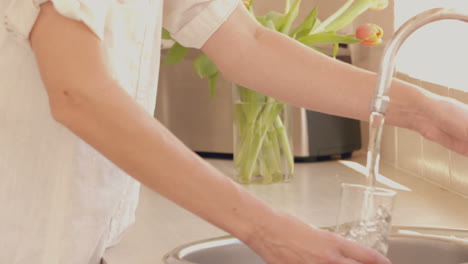 Woman-pouring-glass-of-water