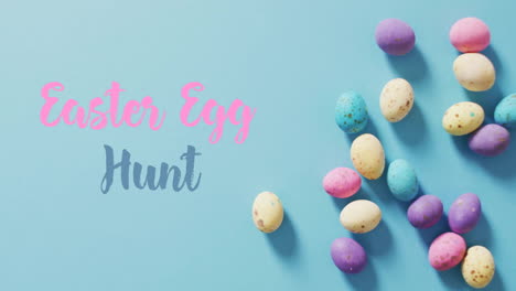 Animation-of-easter-egg-hunt-and-happy-easter-text-over-blue-background