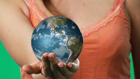 Chroma-key-footage-of-a-woman-holding-a-globe