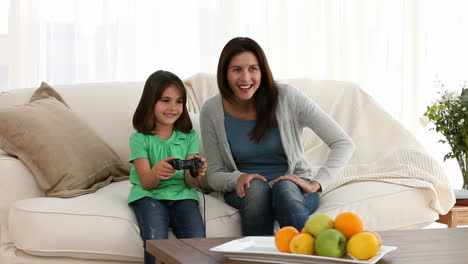 Mother-and-daughter-playing-video-games-