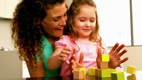 Mother-playing-with-daughter-with-blocks