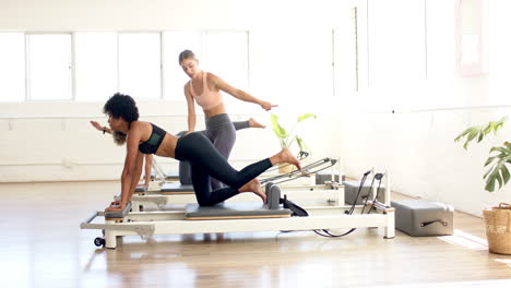 Diverse-group-of-friends-practicing-yoga-at-studio