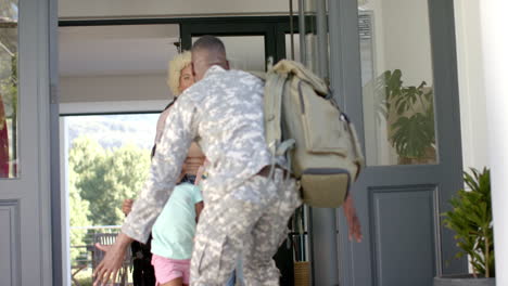 Biracial-family-greets-African-American-father-returning-from-duty