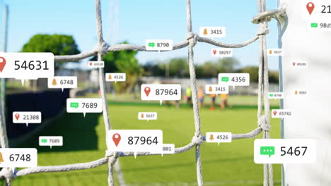 Animation-of-social-media-notifications-processing-over-football-goal-and-team-training