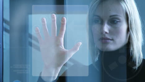 Businesswoman-touching-a-security-system