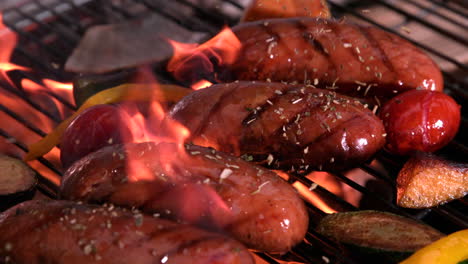 Sausages-being-cooked-on-flaming-barbecue