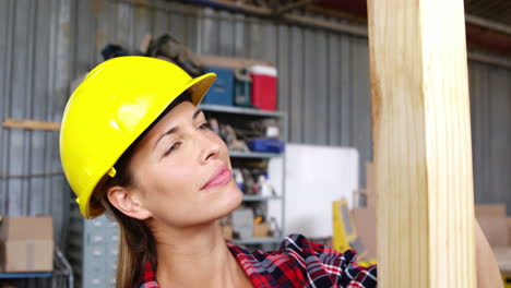 Beautiful-carpenter-looking-at-camera-while-working