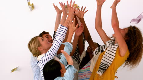 Young-people-throwing-money-on-white-background