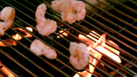 Prawns-being-thrown-onto-flaming-barbecue