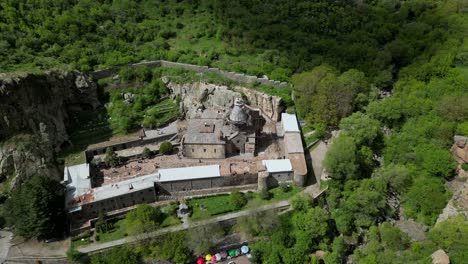 4K-drone-shot-of-the-Geghard-Monastery-tourist-site-in-Armenia-close-to-Yerewan