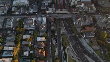 Birdseye-Aerial-View-of-Melbourne,-Australia-Residential-Neighborhood,-Railway,-Street-Traffic-and-Buildings