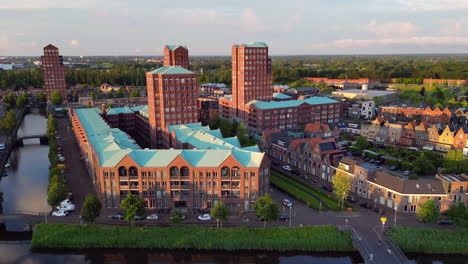 Aerial-view-at-golden-hour-with-modern-buildings-at-Amersfoort-Vathorst,-The-Netherlands