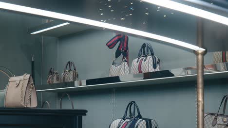 Elegant-Gucci-handbags-displayed-on-shelves-in-a-luxury-store-in-Venice