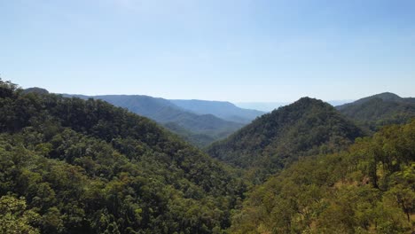 4K-drone-video-flying-through-some-trees-to-reveal-a-stunning-landscape-view-in-Tropical-North-Queensland,-Australia