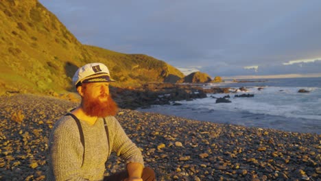 A-1900s-sailor-basks-in-the-warmth-of-the-sun-while-stranded-on-a-remote-Australian-coastline