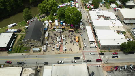 The-bustling-dogwood-fest-in-arkansas-with-crowds,-food-trucks,-and-stalls,-aerial-view