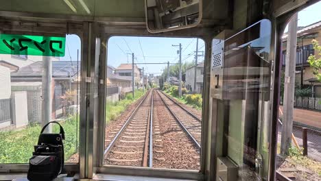 Traveling-Inside-a-Cabin-Train-in-Kyoto,-Japan---POV