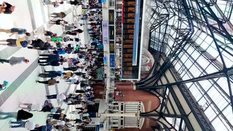 Liverpool-Street-Station-in-England's-capital,-the-bustling-concourse,-where-commuters-and-travelers-move-dynamically