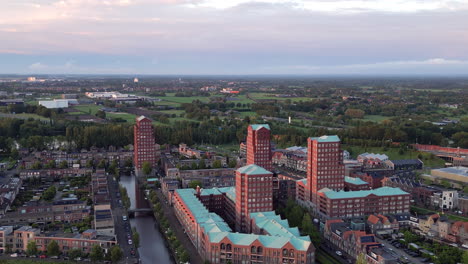 Aerial-view-at-golden-hour-with-modern-buildings-at-Amersfoort-Vathorst,-The-Netherlands