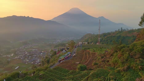 Aerial-Kejajar-village-with-panorama-sunset-view-to-mountain-Sindoro,-Indonesia