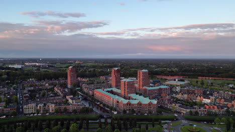 Aerial-view-at-golden-hour-with-modern-buildings-at-Amersfoort-Vathorst,-The-Netherlands