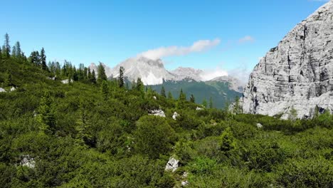 Drone-flight-backwards-over-the-turquoise-Sorapis-Lake