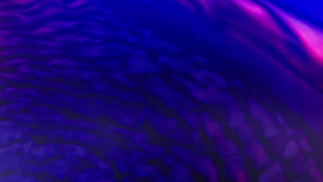 Vivid-purple-and-pink-ink-swirls-underwater-in-a-mesmerizing-abstract-pattern