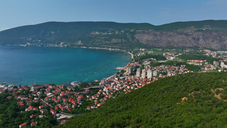 Aerial-view-circling-the-Herceg-Novi-city,-in-sunny,-summer-day-in-Montenegro