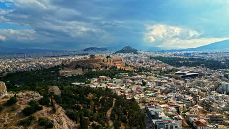 Religious-temple-acropolis-on-greek-mountain-in-ancient-city-Athen,-aerial