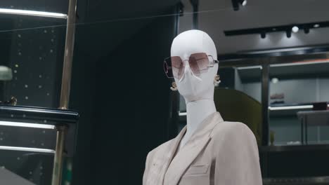 Mannequin-dressed-in-stylish-clothing-and-sunglasses-in-a-high-end-boutique