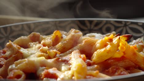 Freshly-Cooked-Arrabiata-Pasta-with-Cheese-and-Steam-Rising-in-Slow-Motion