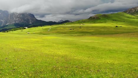 Woman-sits-in-a-mountain-meadow-and-enjoys-the-view