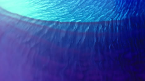 Colorful-ink-swirling-and-mixing-in-water-creating-mesmerizing-patterns-in-vibrant-shades