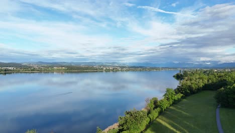 Scenic-aerial-view-of-calm-Greifensee-lake-with-sky-reflection,-Switzerland