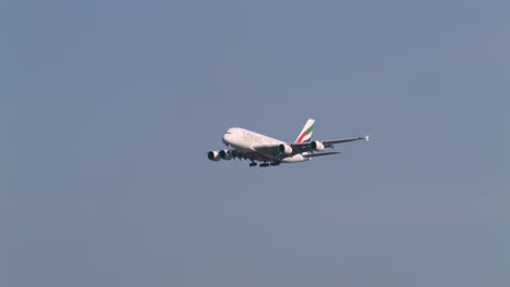 Descending-and-deploying-its-landing-gears-as-it-prepares-to-land-at-the-tarmac-of-Suvharmabhumi-airport-in-Bangkok,-Thailand