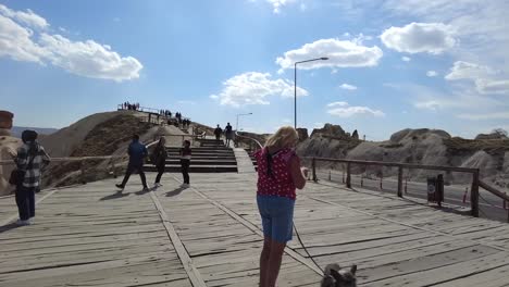 on-a-sunny-day,-people-walking-in-a-tourist-area-in-Cappadocia,-Turkey