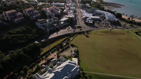 Airlie-Beach,-Queensland,-Australia,-Revealing-Drone-Shot-of-Town-and-Street-Traffic